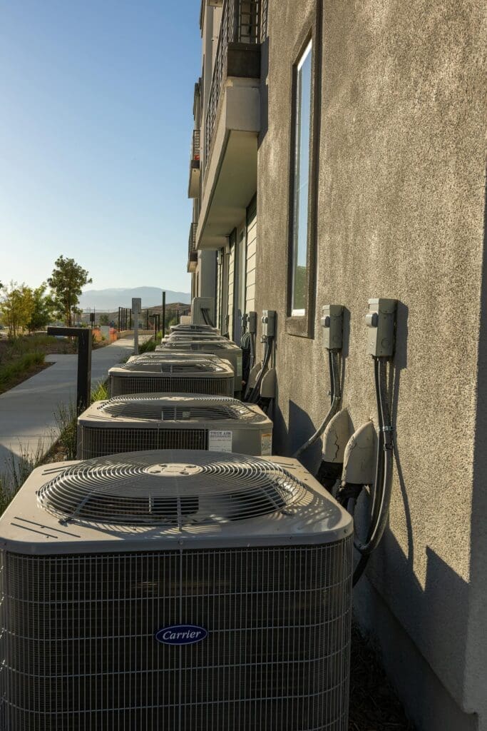 Multiple HVAC units outside condo complex for furnace repair Reno and maintenance