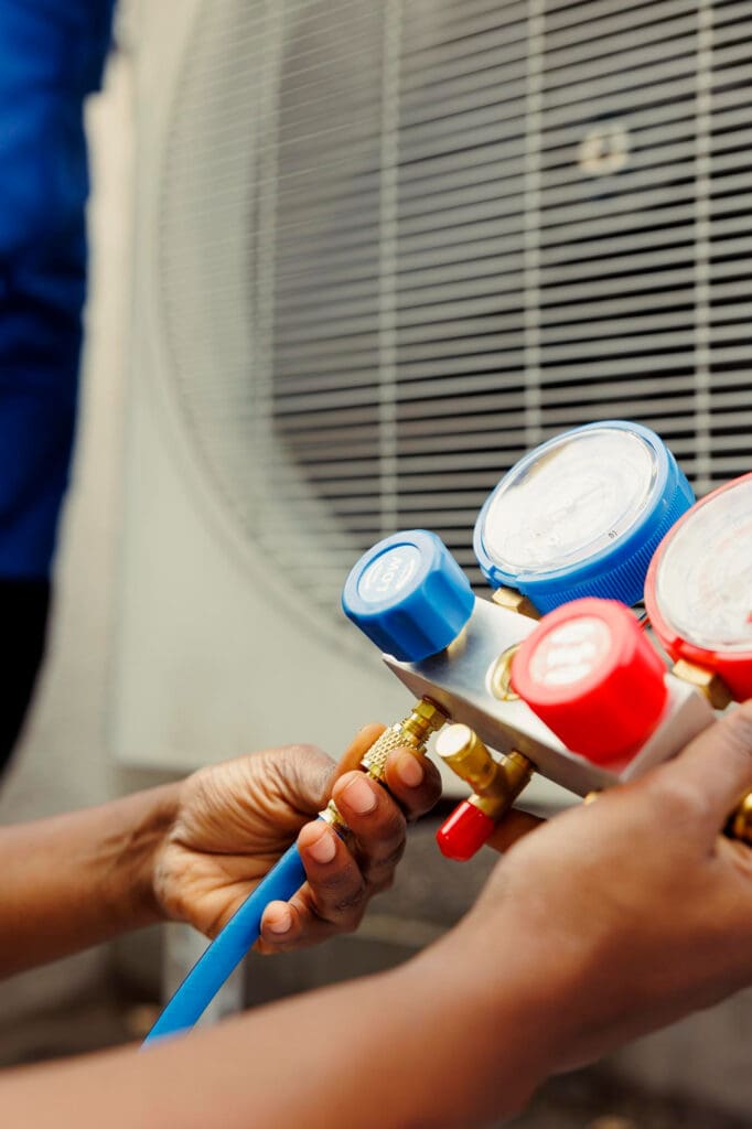 AC repair Reno technician completing HVAC work on a cooling system